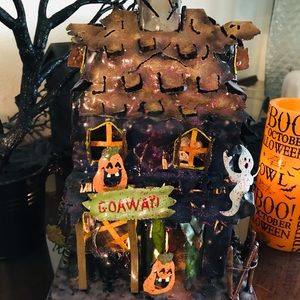 Halloween haunted house. Large candle holder
